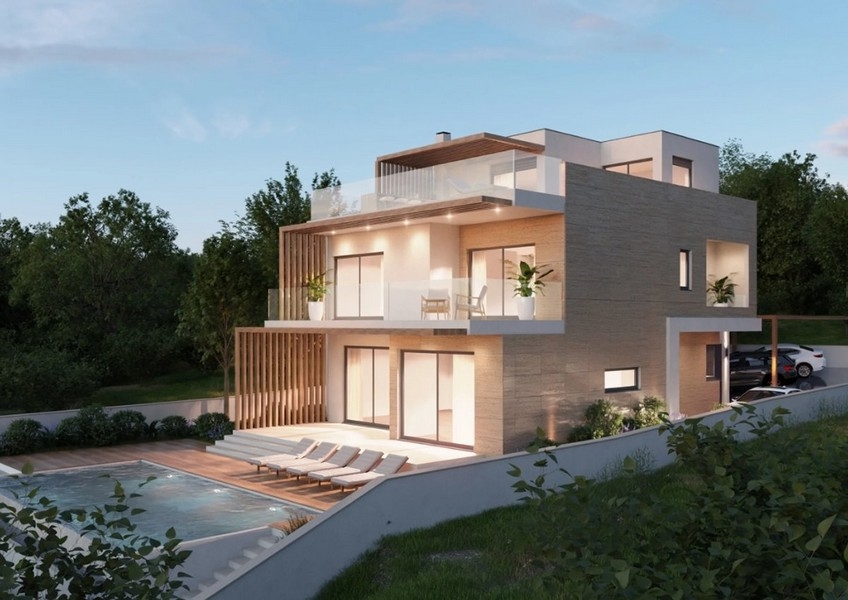 Luftaufnahme einer modernen Immobilie in Kroatien, Villa mit Meerblick bei Nacht