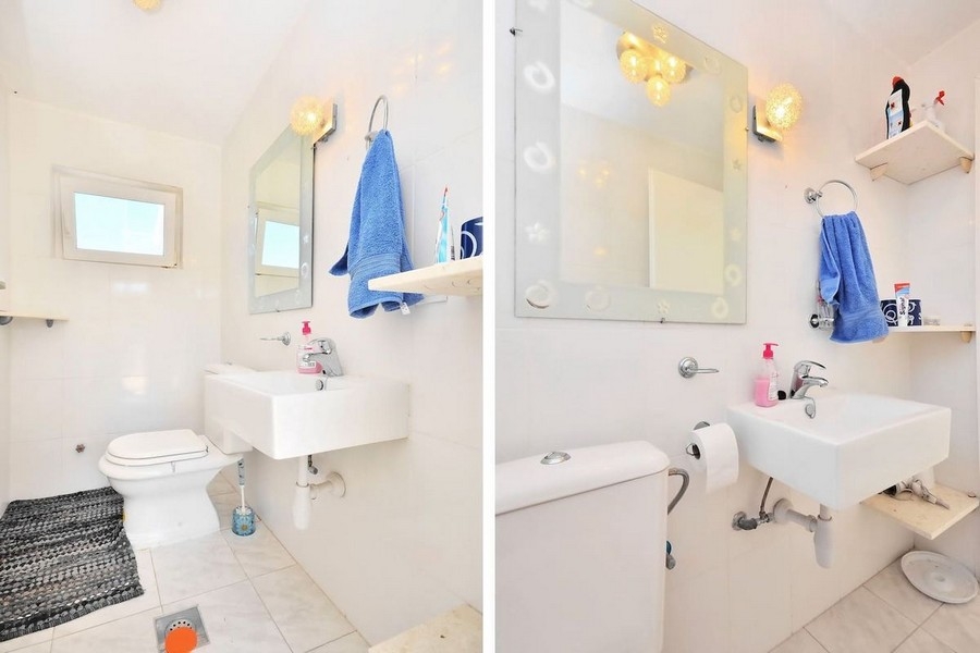 Badezimmer mit Waschbecken und Toilette