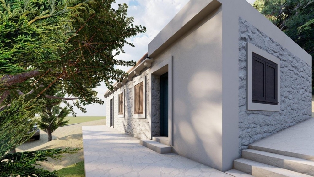 Haus mit Natursteinfassade und großzügigem Außenbereich