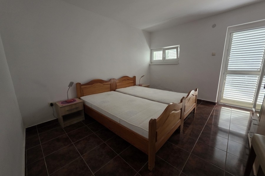 Schlafzimmer mit Zugang zur Terrasse