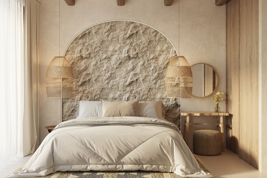 Schlafzimmer mit Natursteinwand und mediterranem Ambiente