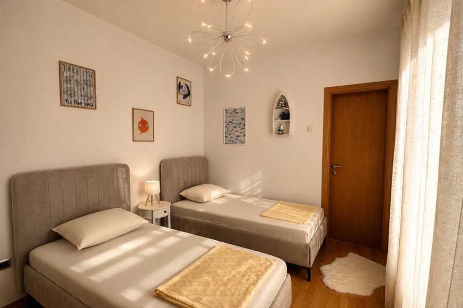 Zweites Schlafzimmer mit zwei Einzelbetten