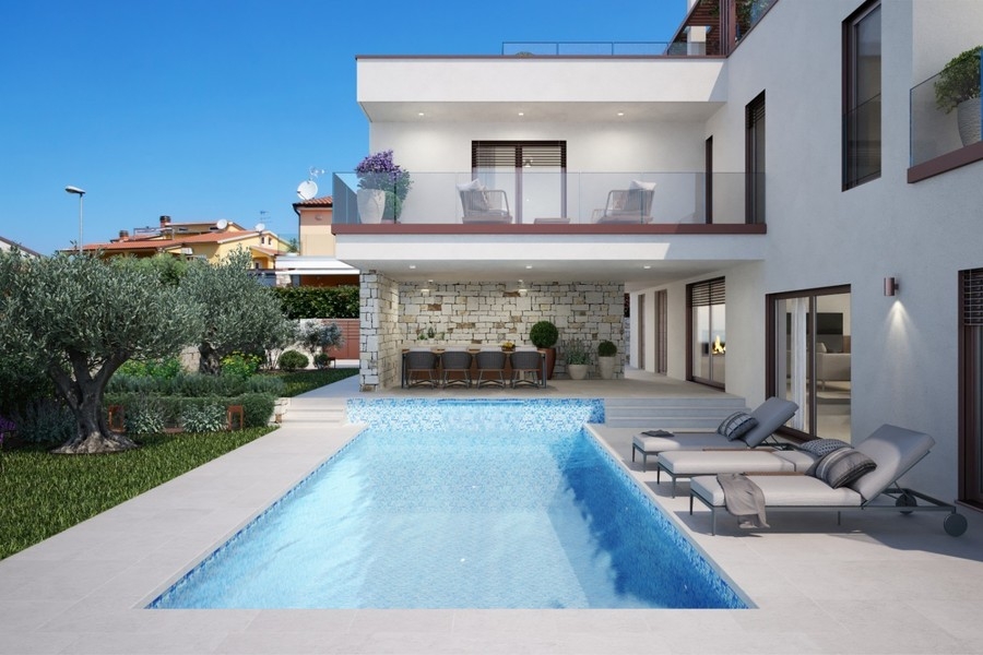 Swimmingpool mit Sonnenliegen vor der Villa in Novigrad