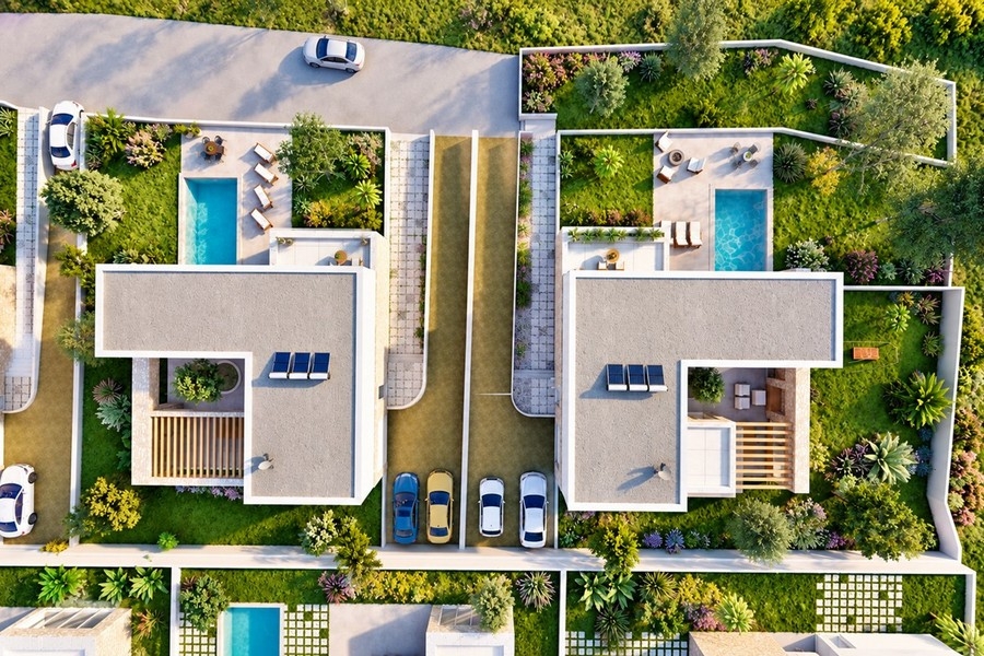 Draufsicht auf die Villen der Anlage mit Parkplätzen