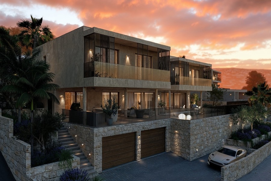 Villa mit Garage und beleuchteter Fassade am Abend