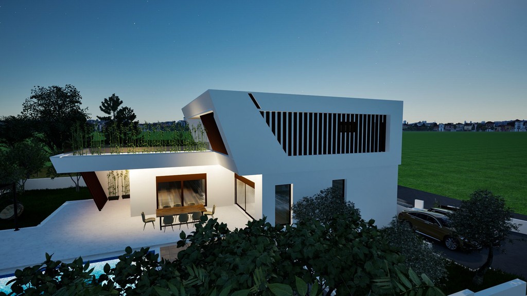 Villa am Abend mit beleuchteter Terrasse