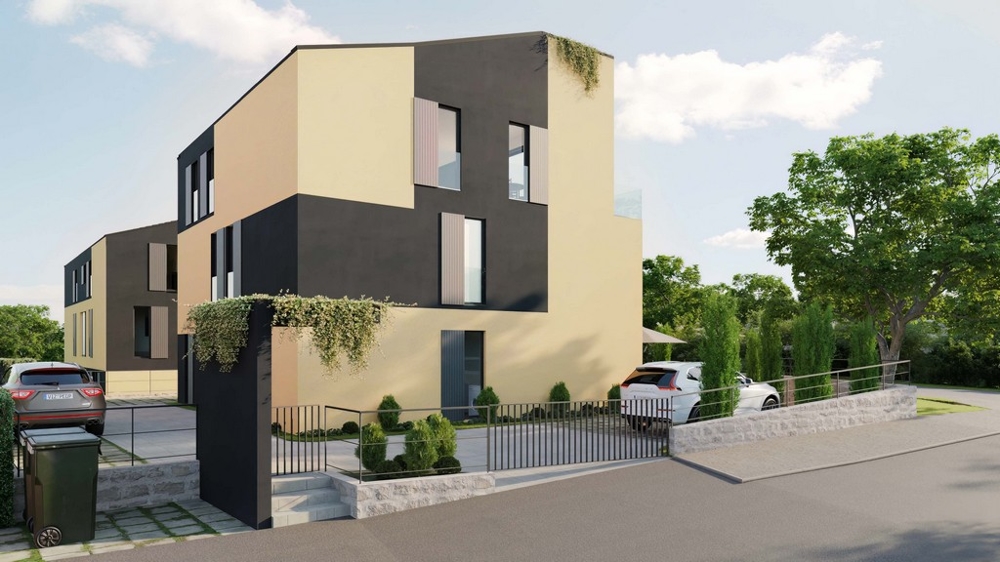 Perspektive von der Straße auf ein modernes Appartementhaus mit dunkler Fassade, umgeben von Zypressen und einer Steinmauer, in einer idyllischen Umgebung – Immobilien Kroatien, Appartement kaufen Insel Krk.