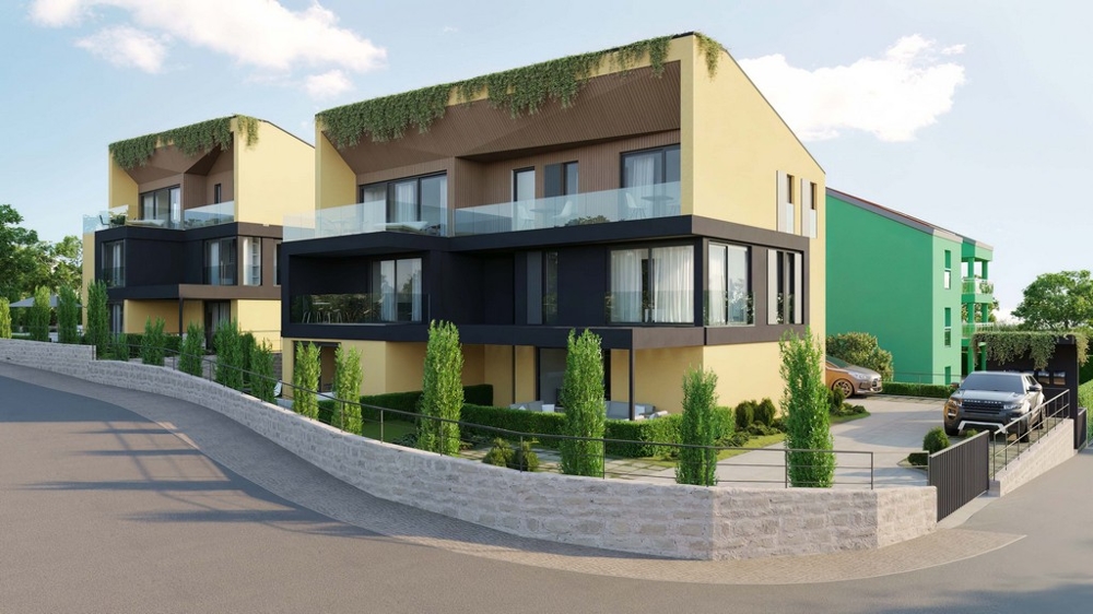 Immobilien Kroatien, Appartement kaufen Insel Krk - Ansicht von der Straße, moderne Appartementkomplexe mit grünen Dächern und Balkonen