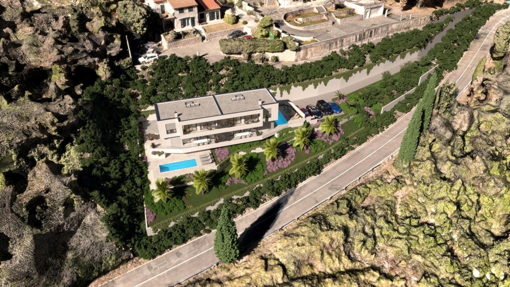 Luftaufnahme des Grundstücks mit Gebäude und Pool