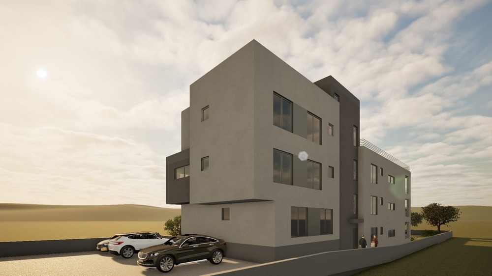 Neubau Wohngebäude mit Stellplätzen vor dem Gebäude