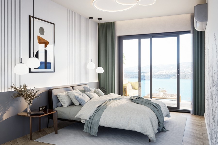 Schlafzimmer mit Meerblick und Glasfront