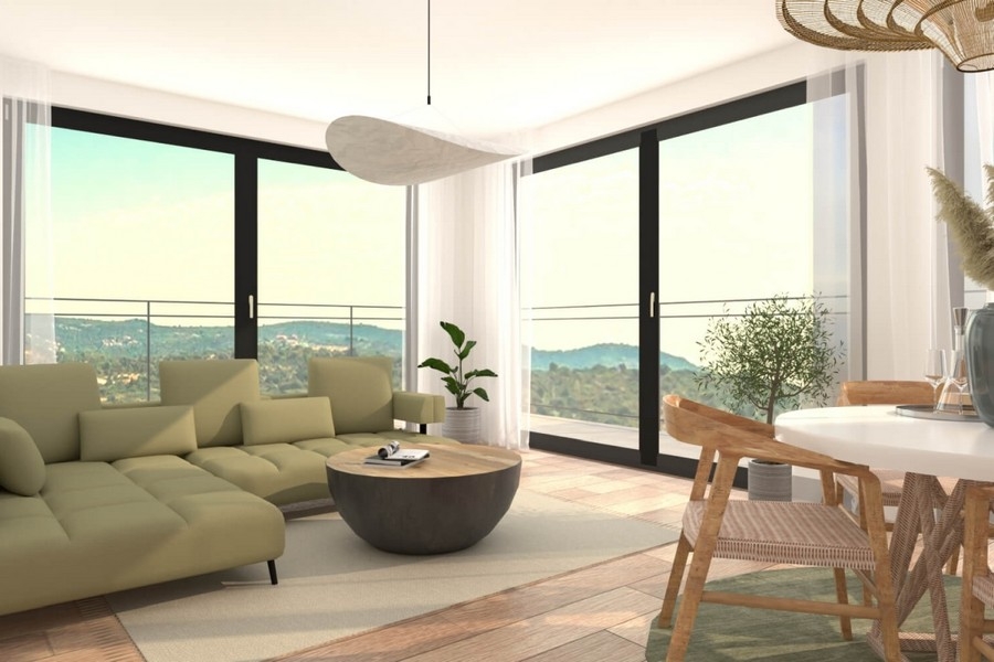 Heller Wohnbereich mit großer Fensterfront und Meerblick