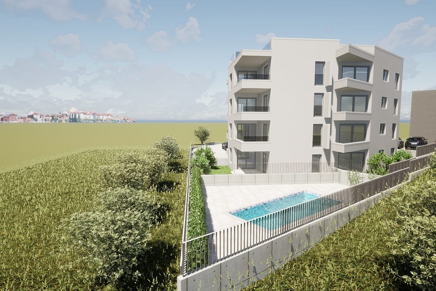 Neubau von der Gartenseite, dahinter das Meer