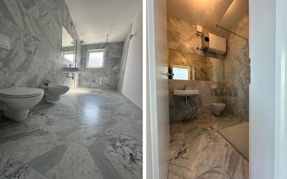 Badezimmer mit Dusche und Waschbecken